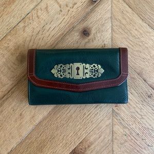 Vintage wallet, dark green with brown accents.